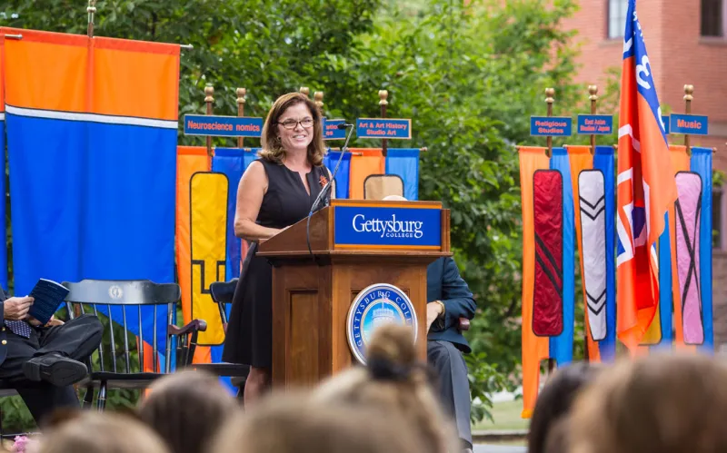 Professor Anne Douds speaking from a podium