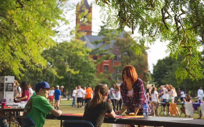 busy outdoor tabling event with Glatfelter hall in background