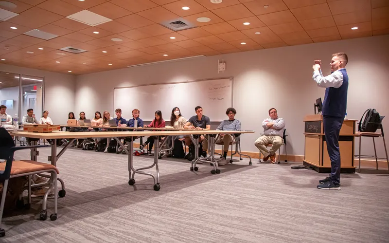 Richard Kampart speaking to a class 