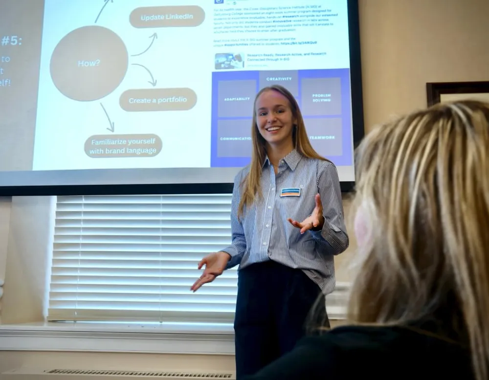 student speaks at front of class