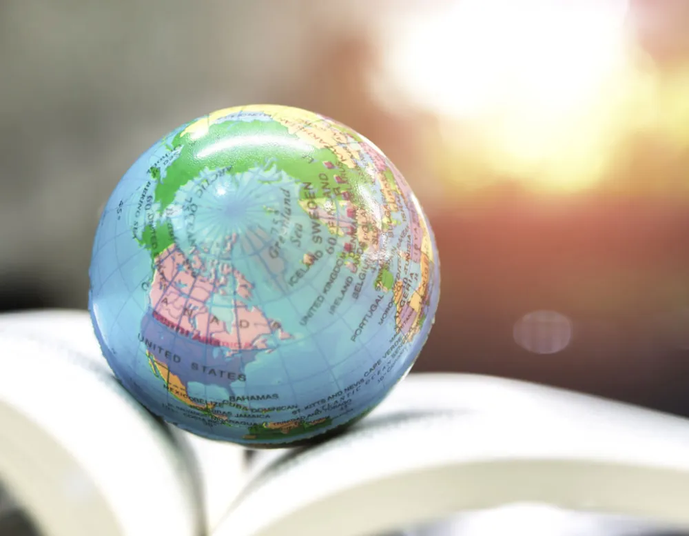little globe on a book