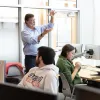Male professor teaches in computer lab